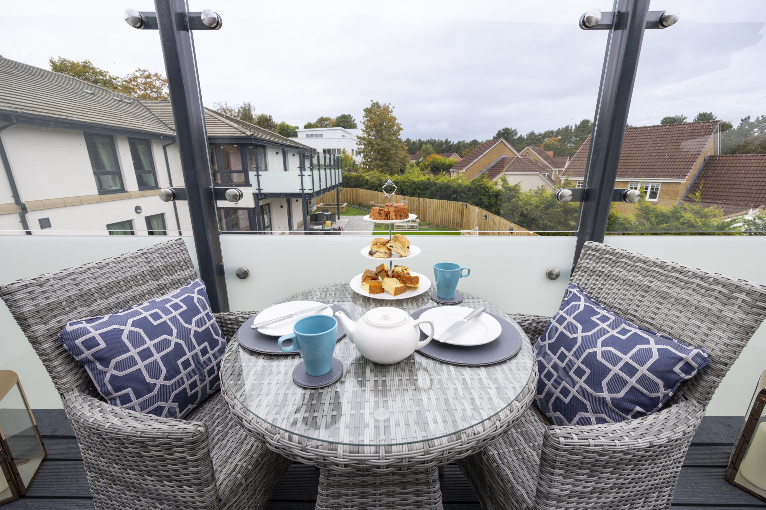 Afternoon Tea Outside on Chairs and Tables on Balcony