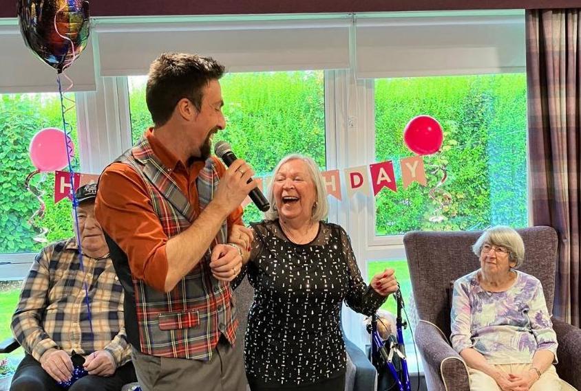 Singer at care home birthday party