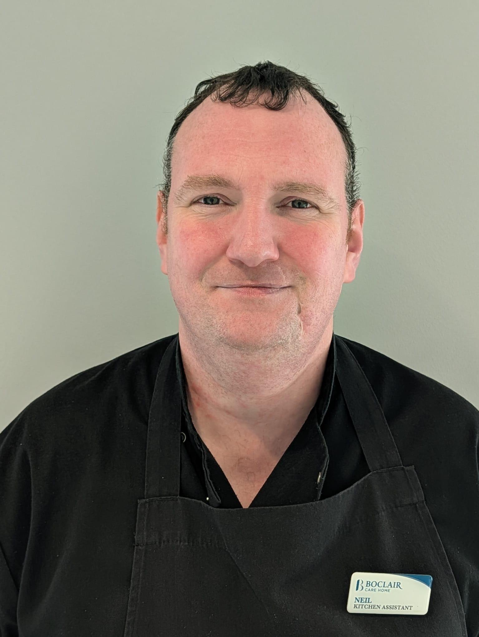 man in black kitchen uniform